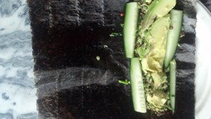 Ingredients placed on nori sheet, on short side.